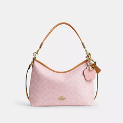 C*ACH - Laurel Shoulder Bag In Signature Canvas With Charms - Gold/Powder Pink