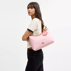 C*ACH - Laurel Shoulder Bag In Signature Canvas With Charms - Gold/Powder Pink
