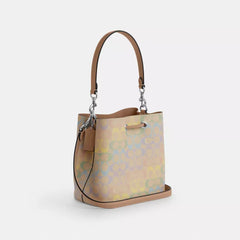 C*ACH - Rowa* Bucket Bag In Rainbow Signature Canvas - Silver/Sand Multi