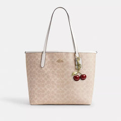 C*ACH - City Tote Bag In Signature Canvas - Gold/Sand/Chalk