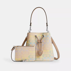 C*ACH - Rowa* Bucket Bag In Rainbow Signature Canvas - Silver/Sand Multi